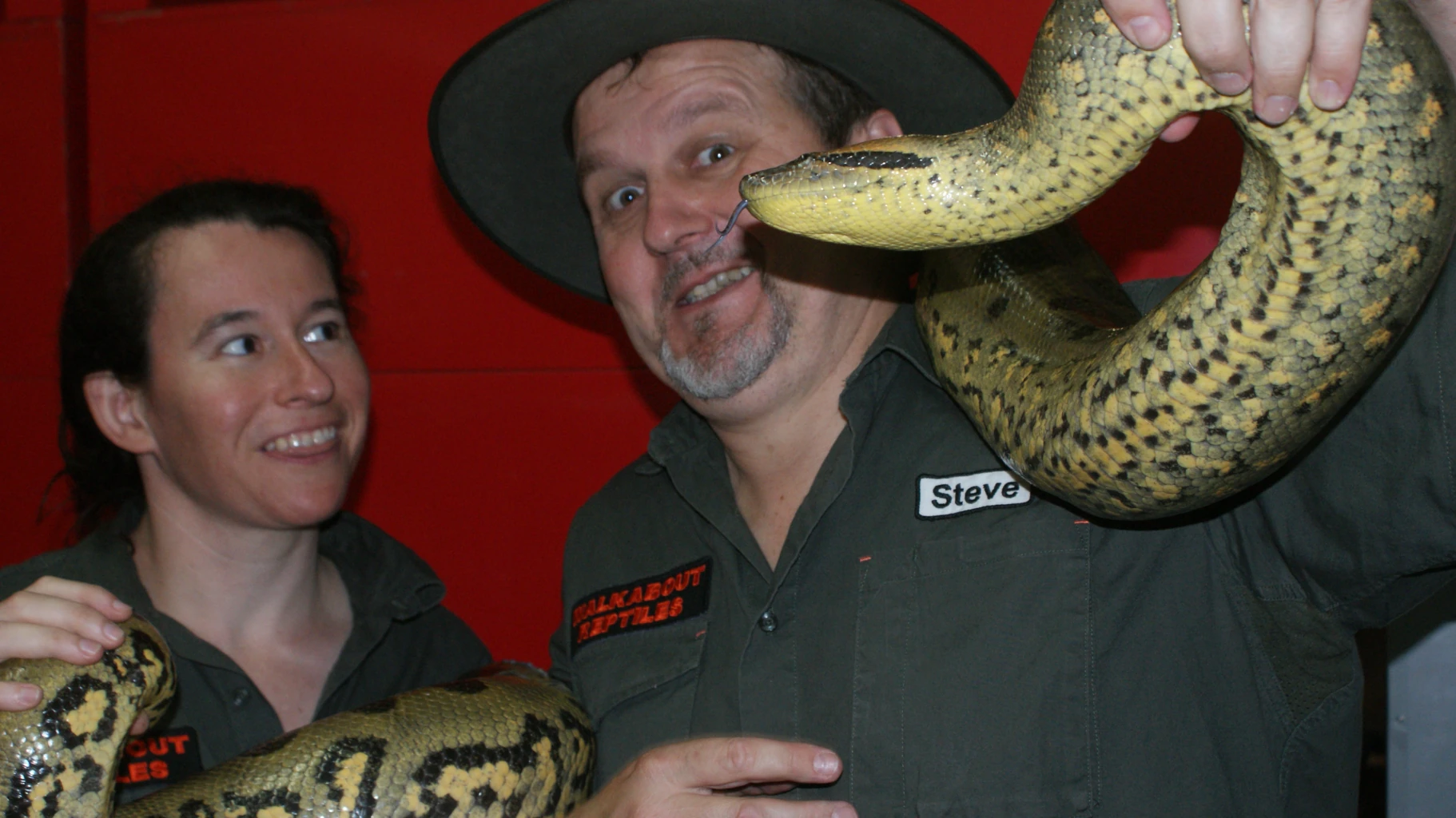 Steve & wife Franca cuddling an Anaconda